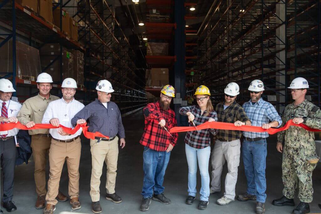 BIW employees cut ribbon during the Kitting Terminal Ribbon Cutting Ceremony