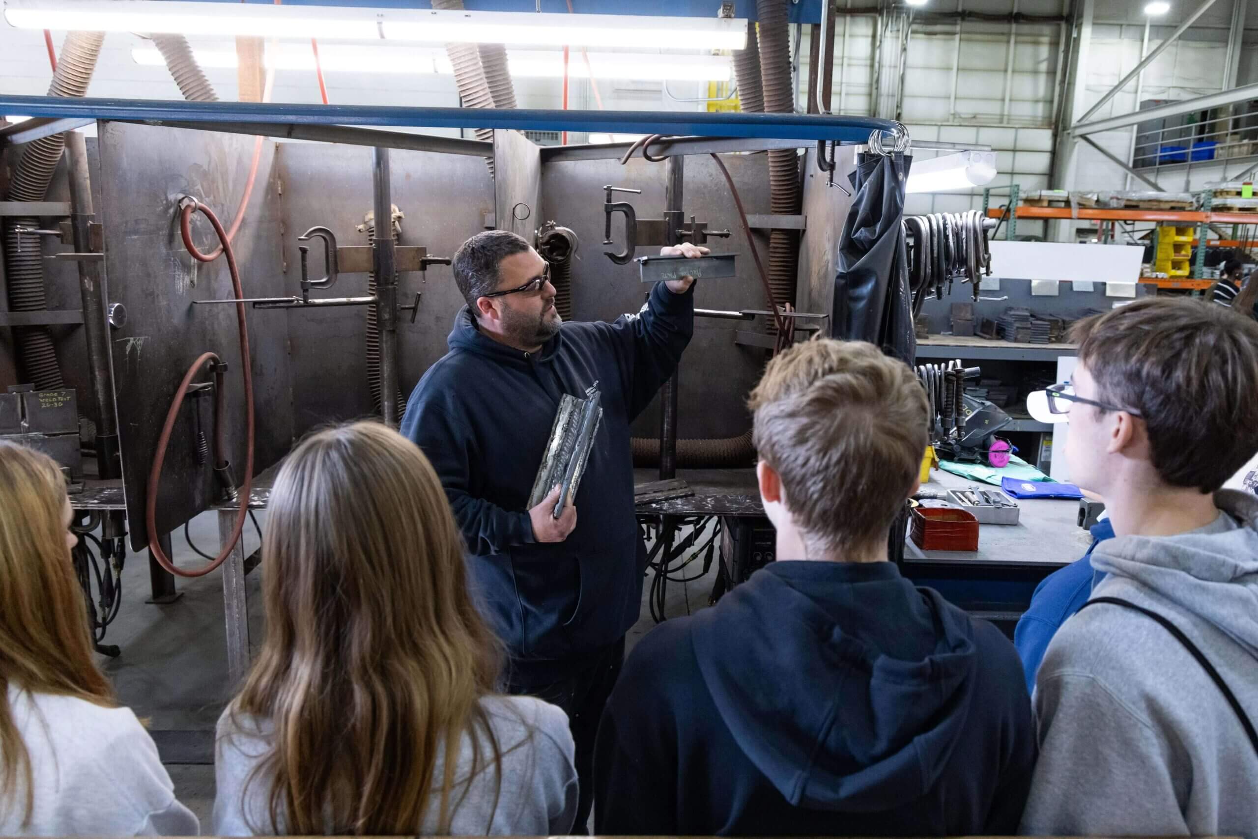 BIW shipbuilder teaches high school students during an open house