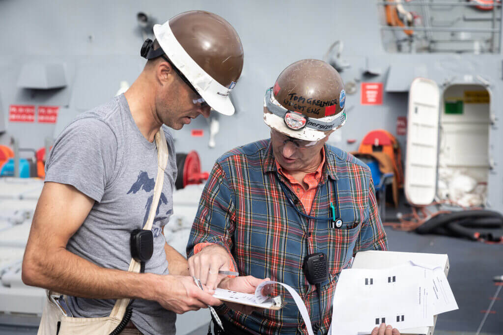 Two BIW engineers look at reports during inclining ways