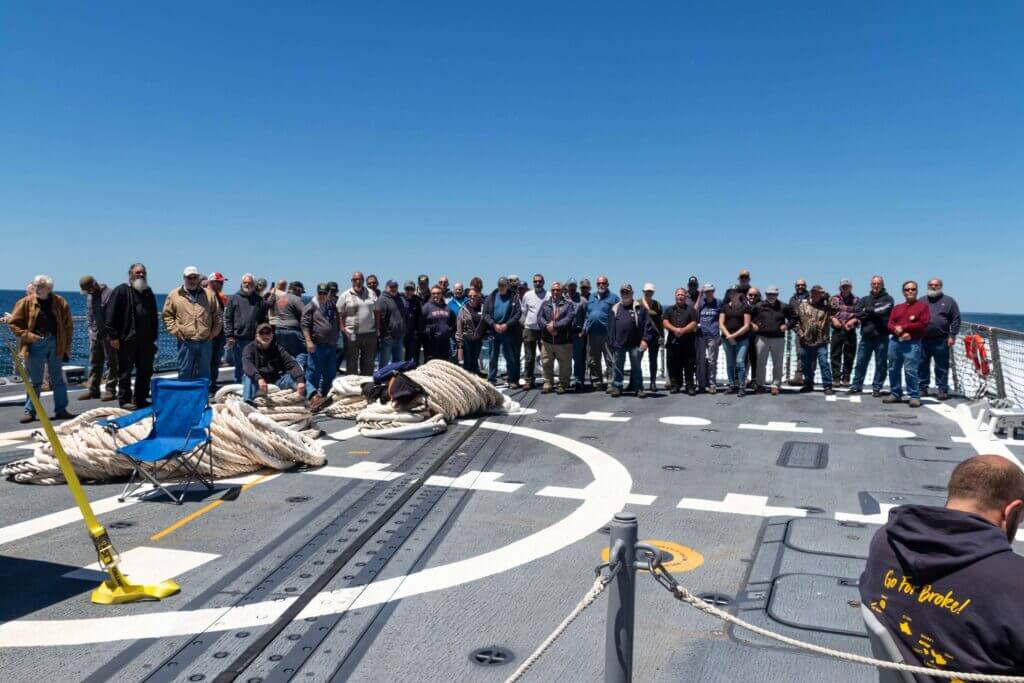 Group of honor riders on the flight deck of DDG 122