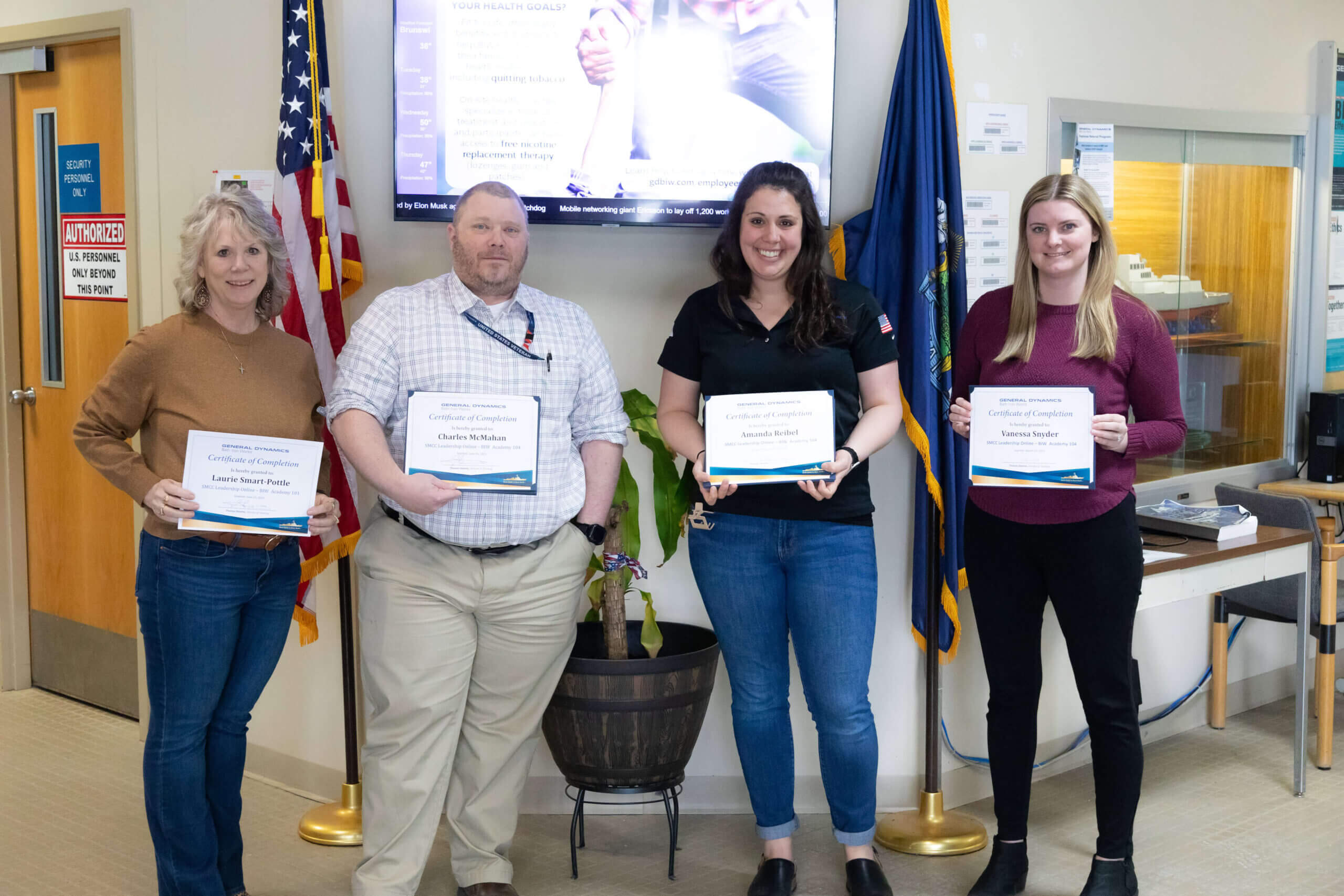 BIW employees hold their leadership diplomas