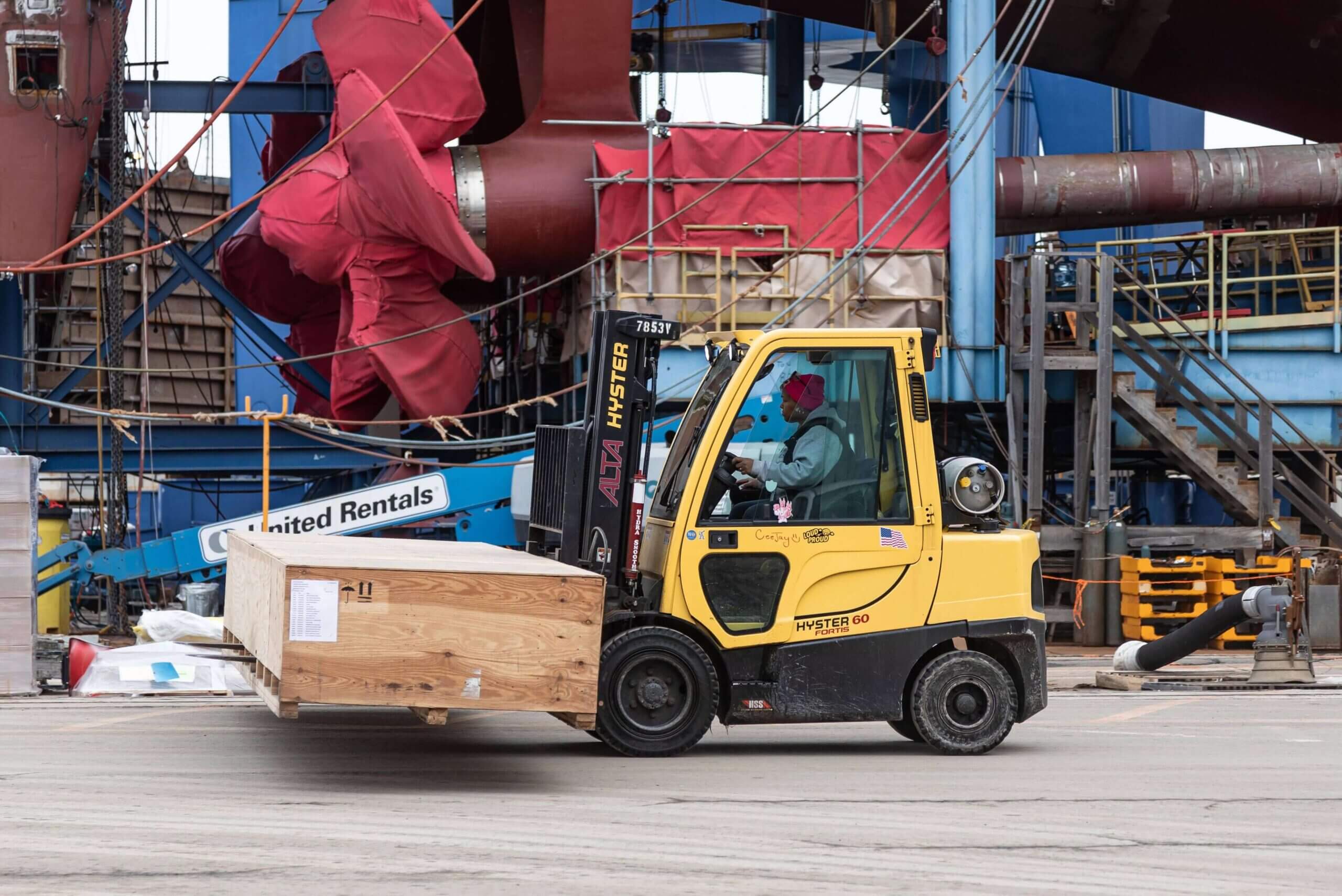 Material Handler in forklift transports materials 