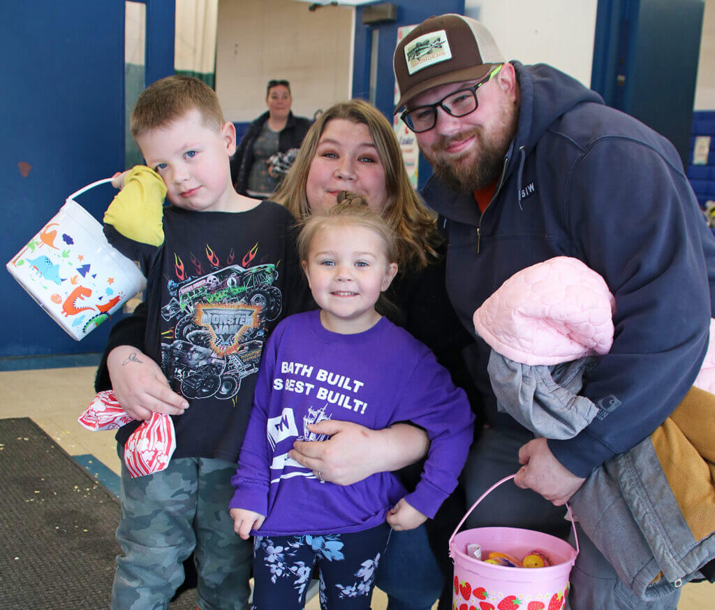 Family poses during BIW Easter Egg Hunt
