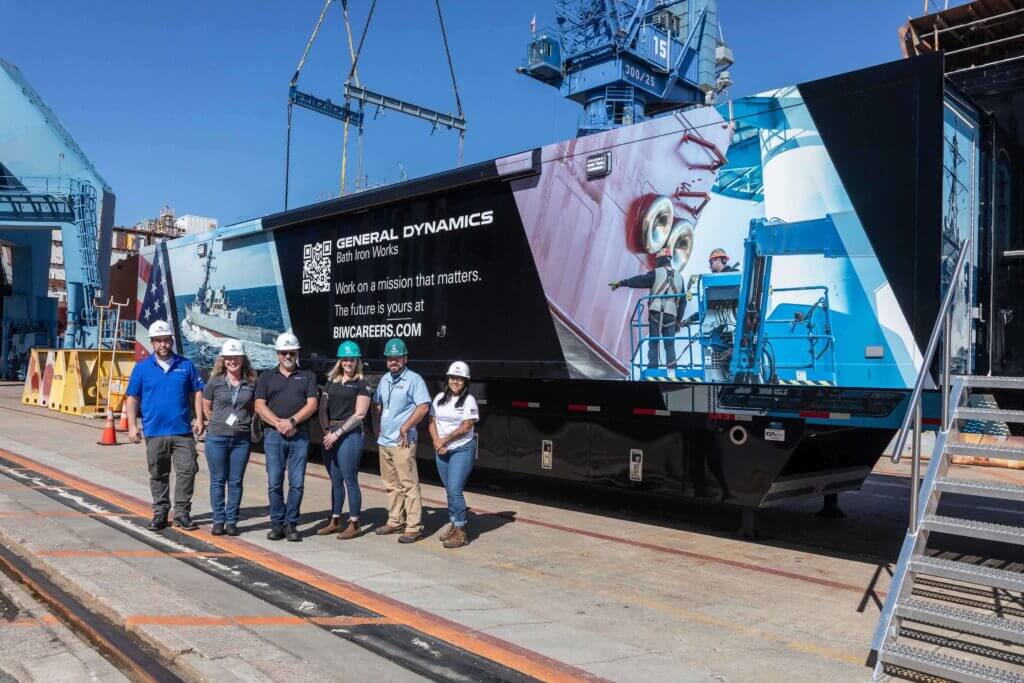 BIW Hiring Team stands in front of Shipbuilder 1 Training Trailer