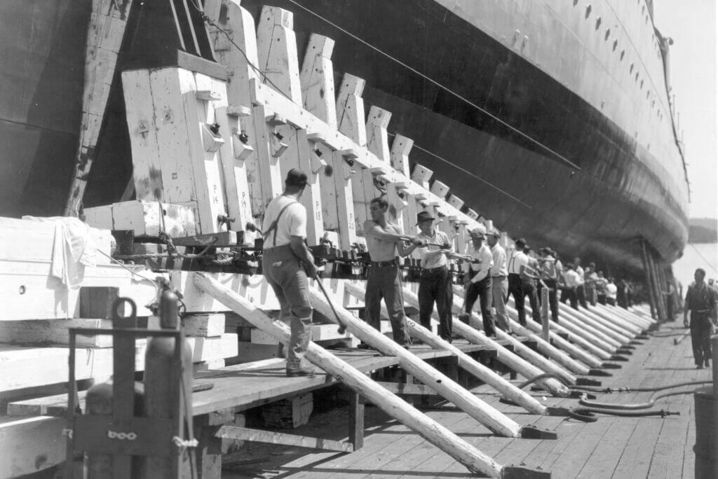 BIW shipbuilders drive wedges during USS Livermore launch