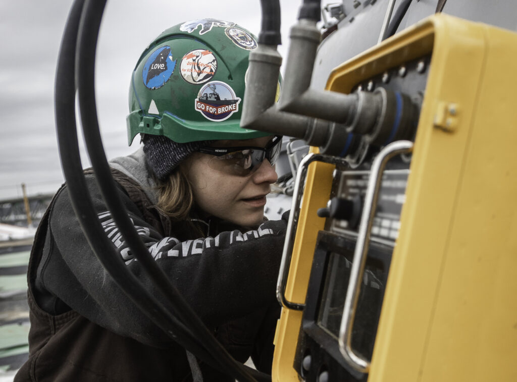 Female electrician at BIW works on ship