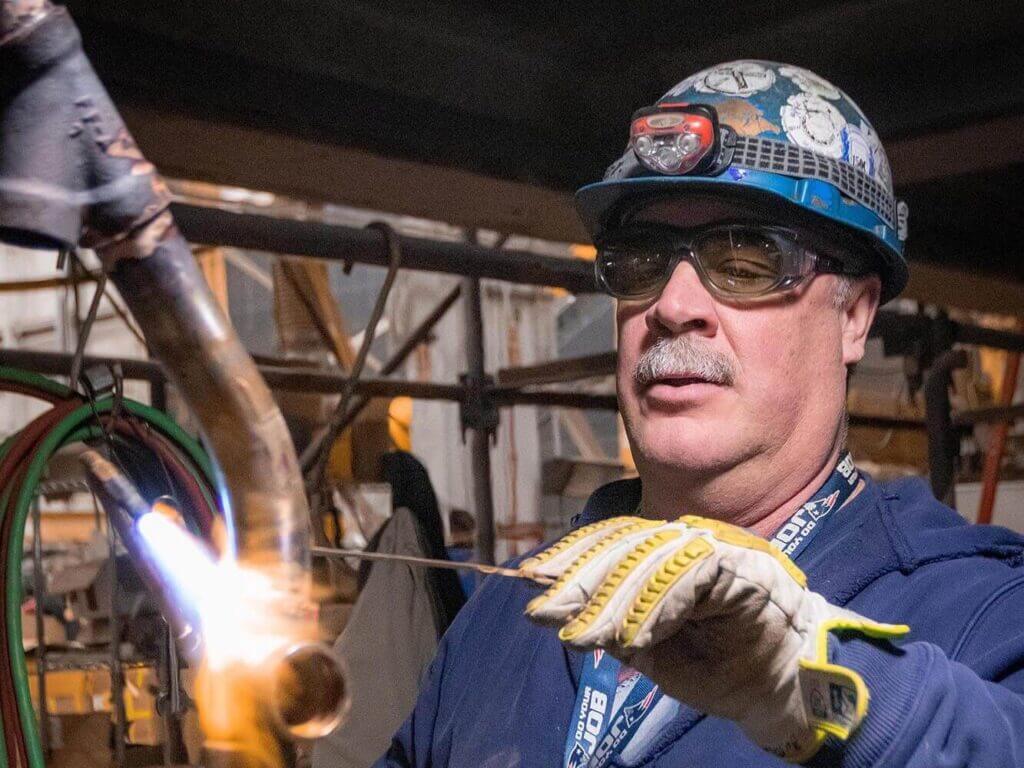 Pipefitter working at BIW shipyard